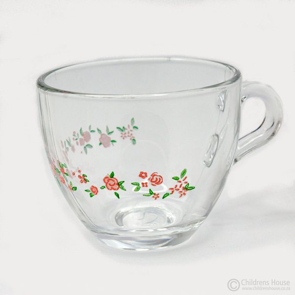Featured Image of a small, glass cup that holds 50ml, and has a design of roses print on the middle. This cup fits the saucer and the small stainless teaspoon.