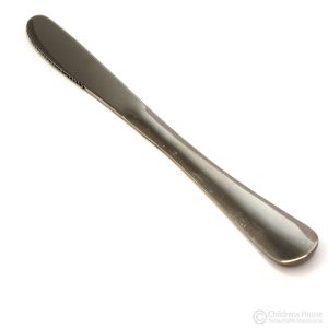 Childrens House offer this small stainless steel knife which shows the convex molded handle uppermost. The handle is moulded from the blade to fit small hands. This item is ideal for a young child learning to use a knife.