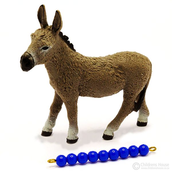The featured image is of a mule, also known as a male donkey. Laying next to the donkey, is a dark blue, 9 bead stair, to illustrate the size of the donkey. This bead stair can be purchased separately. The donkey is part of the herd or family of donkeys. This language object, forms part of an activity known as The Farm in the Montessori Language Curriculum. It can be purchased individually, or as part of the complete Farm activity.