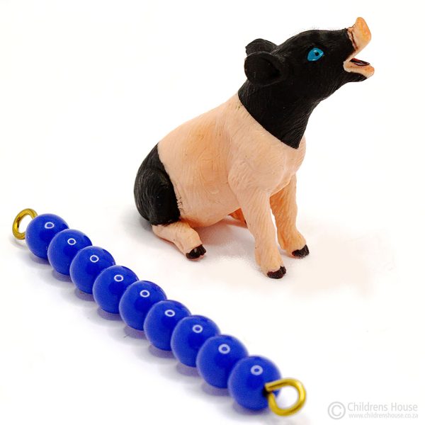 The featured image is of a black & pink piglet. The piglet is part of the sounder family. Next to the piglet, lies a dark blue, 9 bead stair, to indicate the size of the piglet, which can be purchased separately. This language object, forms part of an activity known as The Farm in the Montessori Language Curriculum. It can be purchased individually, or as part of the complete Farm activity.