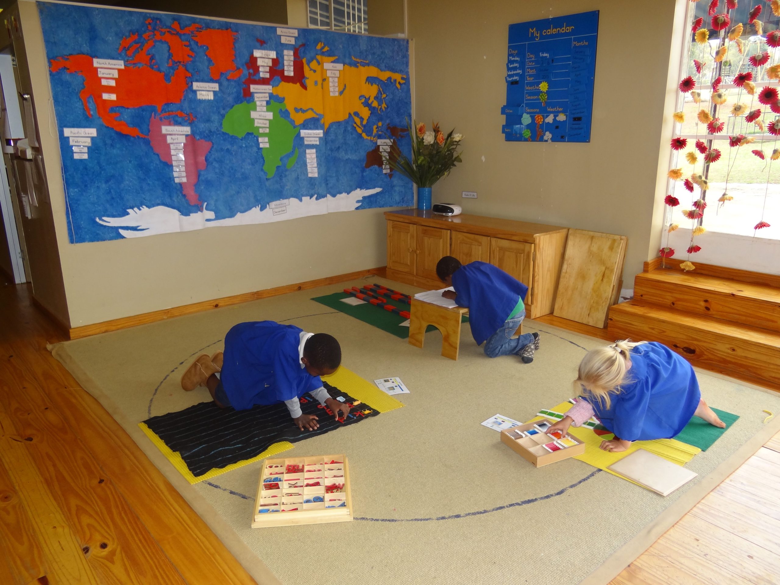 SilverOaks Montessori School learners at work with various activities. Geography is always introduced through the world puzzle maps first.