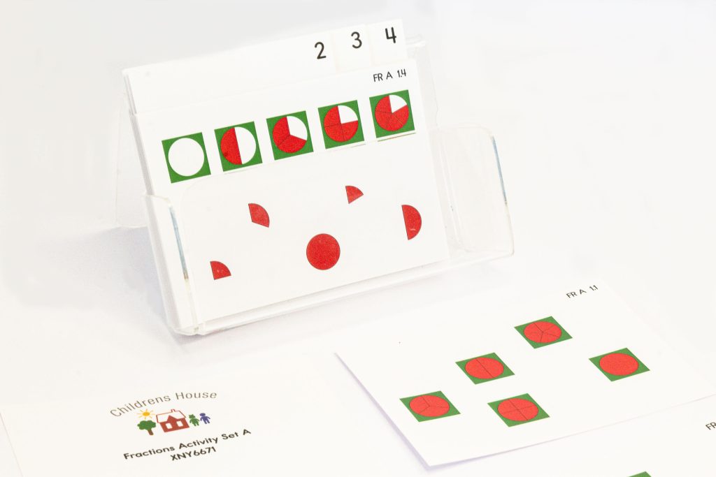 This is a close-up of the colourful Fractions Activity Set A. This activity is extremely useful. The set of cards, provides extended exercises for the Child as they work with the metal Fraction circles.
