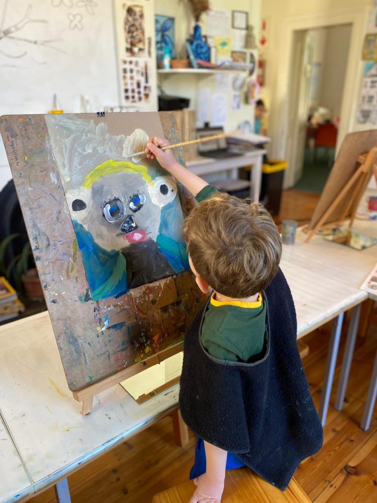 Auburn House Montessori School, a young artist at work, painting a self image in oils