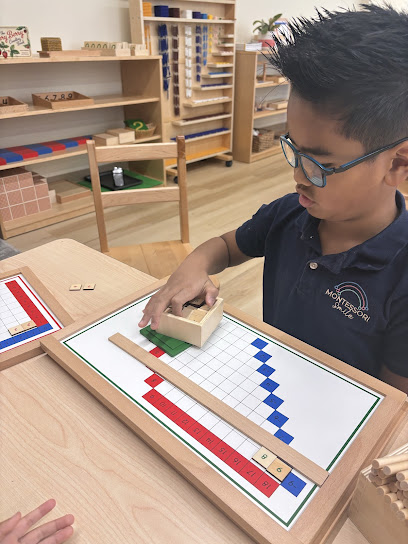 A primary student working with the Montessori activity called the Strip Board at Montessori Smile School. This activity is designed to help children concretely understand arithmetic.