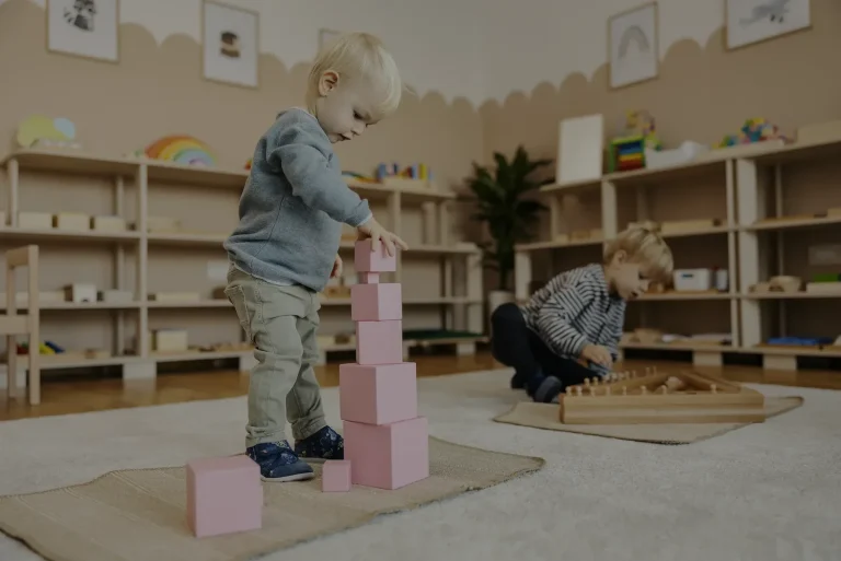 Country Meadows Montessori School are looking for a Primary Guide to lead the children from Phase1 to Phase2. This image shows a 3-year old child working with the Pink Tower, the basis of mathematics but experienced sensorially.